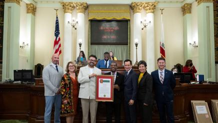 Photo holding Resolution with Assemblymembers and Adan Chavez