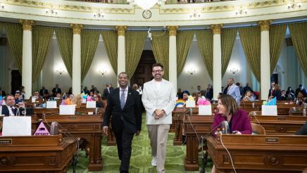 Assemblymember Jackson escorting Adan Chavez