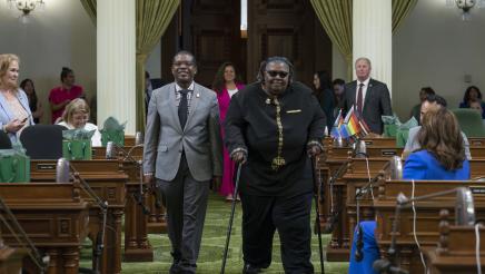 Dr. Jackson escorts Rev. Benita Ramsey on the Assembly Floor